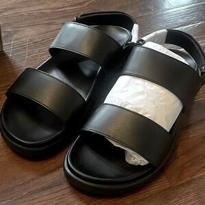 Brand new, black leather sandal.